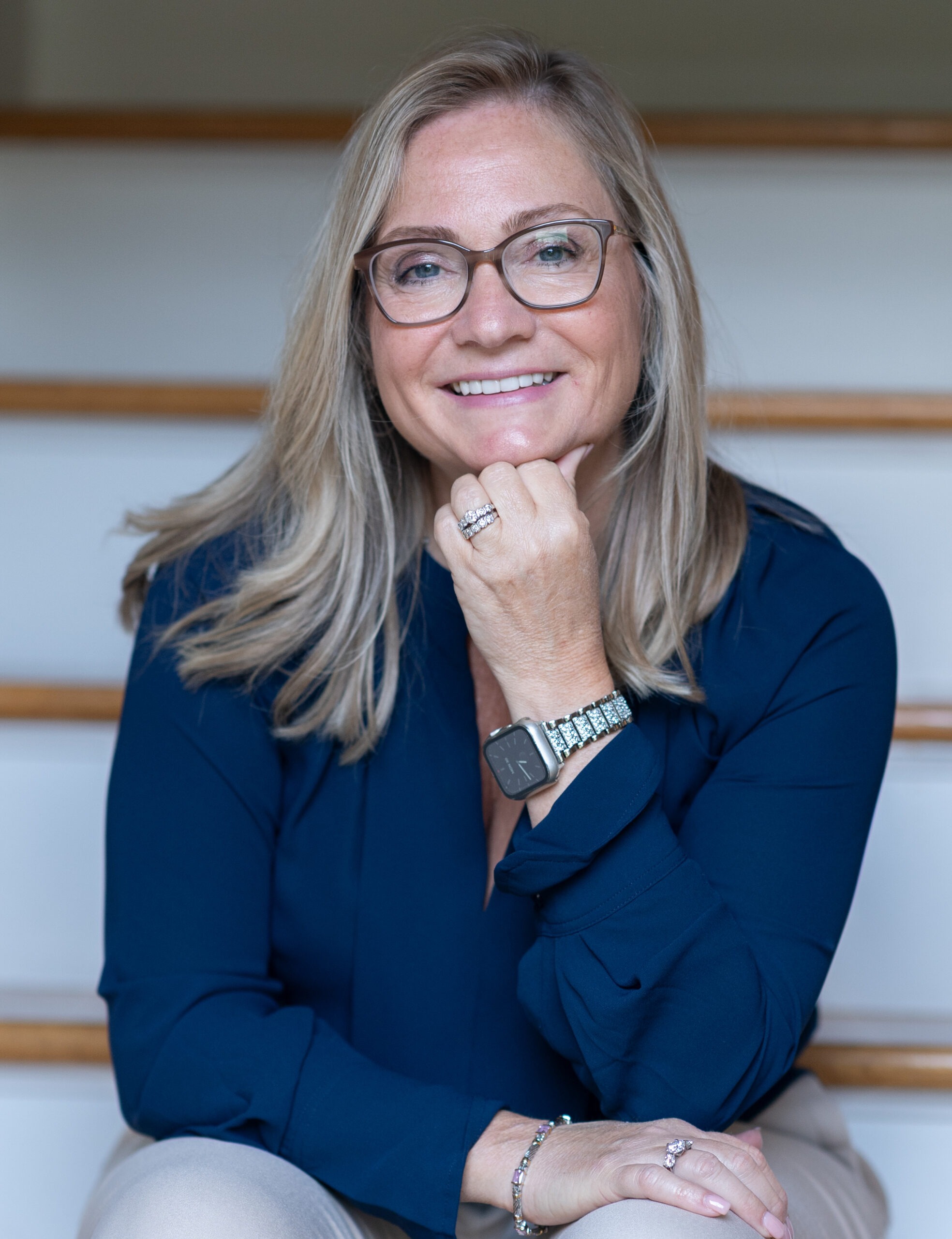 Theresa Debrow sitting and smiling